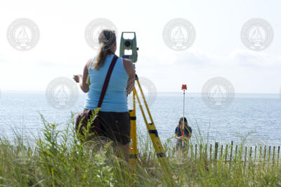 Andrea Hawkes (foreground) and Leah Fine (SSF) surveying coastline.