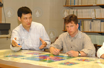 Jian Lin and Greg Hirth looking at maps.