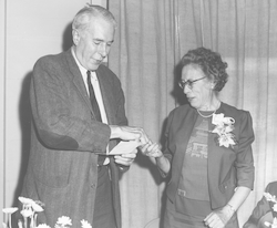 Columbus Iselin presenting pin to Helen Phillips.