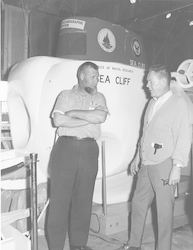 Cliff Winget talking with unidentified man