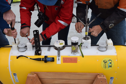 Preparation of a moored profiler on its cradle on deck.