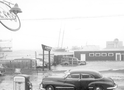 Hurricane Carol, front of Landfall restaurant, steamship at left.