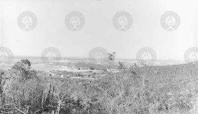 Atlantis ashore with warships in harbor