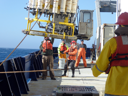 Recovery of CTD water sampling rosette to R/V Roger Revelle.