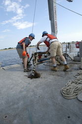 Postdoctoral Dave Ralston and Jay Sisson with a recovered mooring.