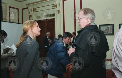 Ruth Curry (left) speaking with a guest at the briefing