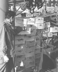 Gene Krance and crates of water sample bottles