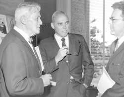 Alfred Redfield (l) talking with others.