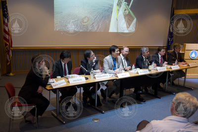 Panel of colloquium participants interacting with the audience.