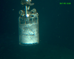 Alvin manipulator using a corer to sample during Alvin dive 3814.