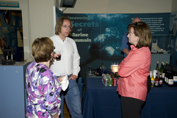 People enjoying the reception at the Exhibit Center after the colloquium.