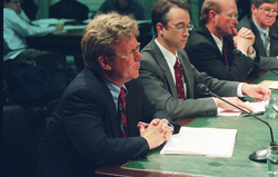 Bill Curry and other panelists testifying at a Senate committee hearing