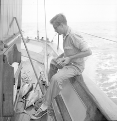 Gus Day on deck of Caryn with tuna.