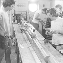 Charles Hollister with paper in hand examining core