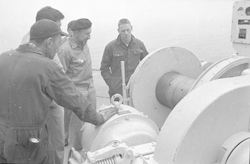 Robert Munns, Bill Halpin, and Dick Edwards discussing winch on Atlantis II.