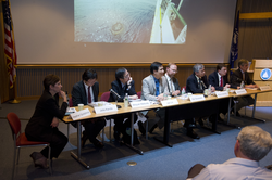 Panel of colloquium participants interacting with the audience.