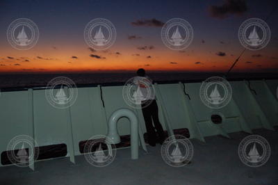 Nika Staglicic on open deck during sunrise.