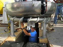 Terry Hammar working under the "dog dish".