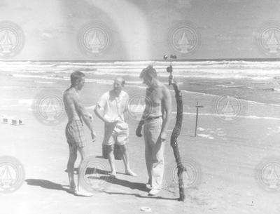 Ted Spencer, Al Woodcock, and Andrew Bunker working on the beach.