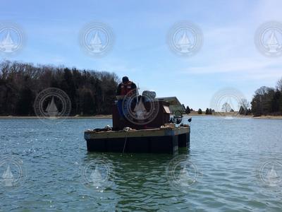 Mike Brosnahan working from a raft outfitted with an Imaging FlowCytobot.