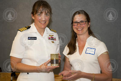 Becky Gast presenting appreciation gift to Captain Stefanyshyn-Piper.