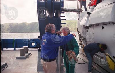 Charles Hollister greets Lisina Hoch after she disembarks from Alvin.