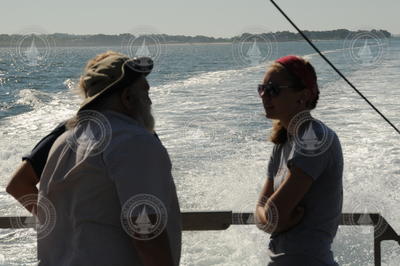 Jim Doutt talking with students during the transit out to Buzzards Bay.