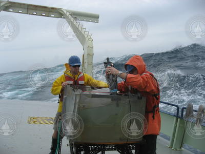 Justin Ossolinski and Ben Van Mooy working out on the stern of the Oceanus.
