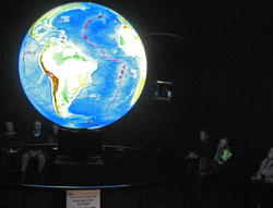 People watching the Global Viewport to Deep-Sea Vents exhibit.