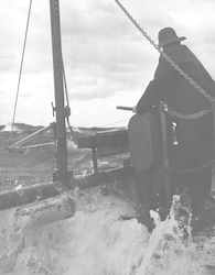 Frank Carey on deck of Chain during rough seas