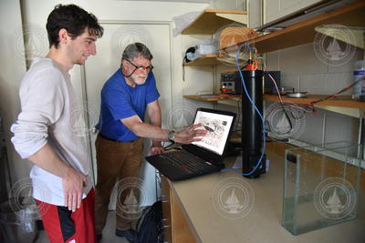 Troy Petitt and Peter Wiebe analyzing holographic images during camera tests.