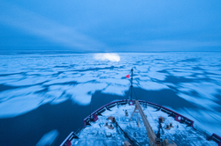 "Pancake" sea ice visible in front of the bow of USCGC Healy underway.