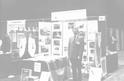 Hartley Hoskins standing before a WHOI display.