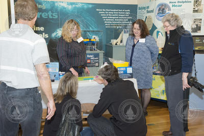 Kathy Patterson showing associates the ocean acidification activity.