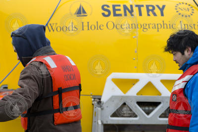 Sean Kelley and Justin Fujii preparing AUV Sentry for dock tests.