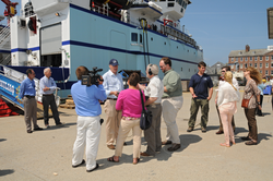 U.S. representative Bill Keating talking with the local press during R/V Sikuliaq visit.