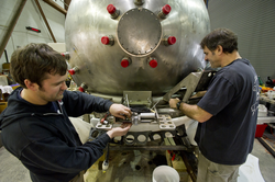Dave Walter and Bruce Strickrott detaching the sphere during disassembly.