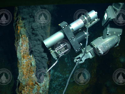 An IGT sampling a black smoker chimney at a hydrothermal vent field.
