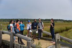 Amanda Spivak (right) talking to the OSJ fellows about wetlands sustainability.