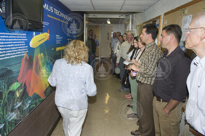 Kathy Patterson leading state officials and OPET members on a WHOI tour.