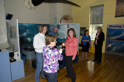 People enjoying the reception at the Exhibit Center after the colloquium.