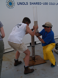 Ellen Roosen and Dan McCorkle carefully recovering a core sample on deck.