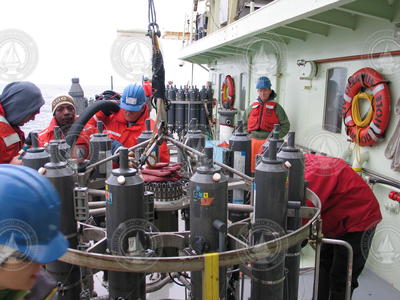 Science team unloading water samples from the CTD rosette.
