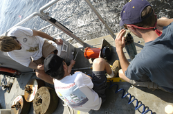 Rocky Geyer in center with postdoctoral investigators Malcolm Scully and Dave Ralston