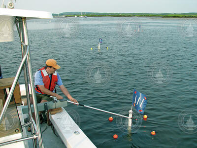 Jim Lerczak working with drifters to study surface water movement.