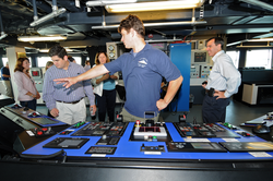 Captain Mike Hoshlyk showing NSF associates the bridge on R/V Sikuliaq.