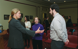 Ruth Curry (left) speaking with attendees at the briefing