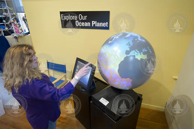Kathy Patterson with the Magic Planet at the Exhibit Center.