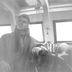 Dick Colburn in the wheelhouse aboard Atlantis.