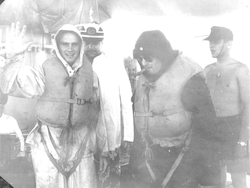 Men in life vests at Equator Crossing ceremony.